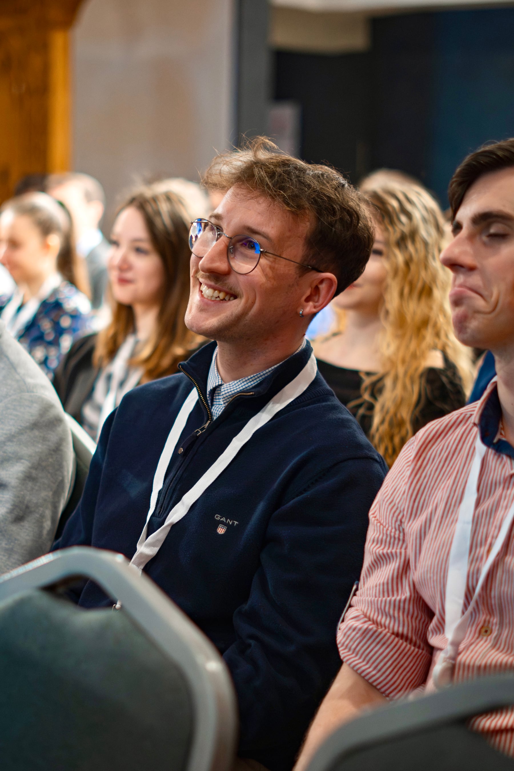 Krisztián listening during a professional event