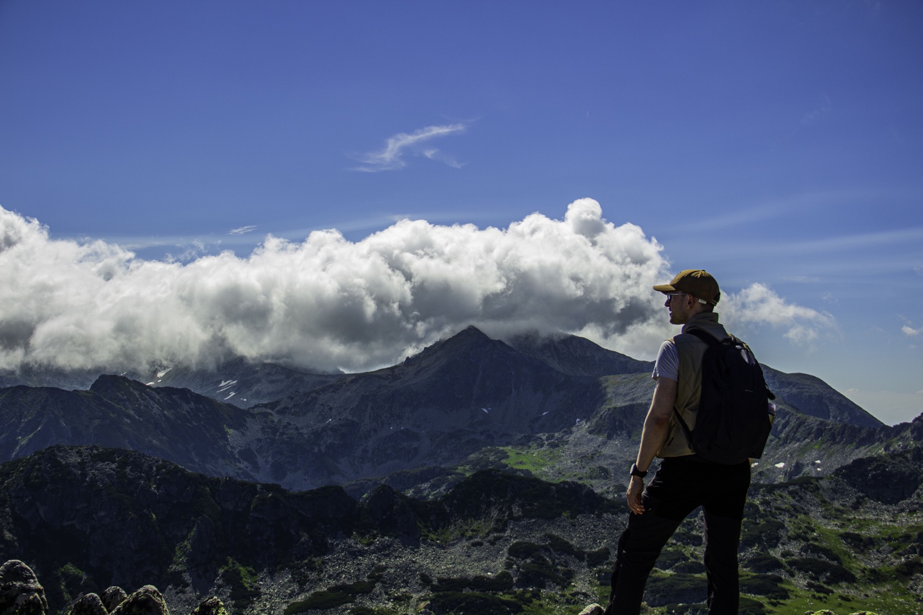 Krisztián looking across a mountain landscape